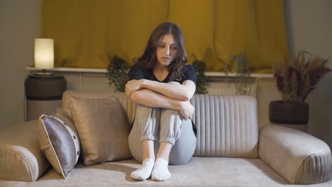 Depressed-young-woman-alone-at-home.